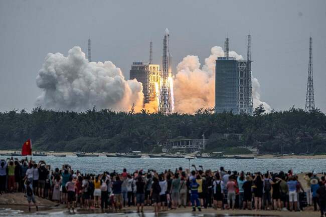 Rocket tumbling to Earth is likely to fall in international waters and is 'not worth panicking about', Chinese paper says