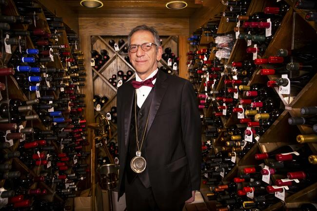 Vintage Vegas sommelier restocking wines for 100% reopening