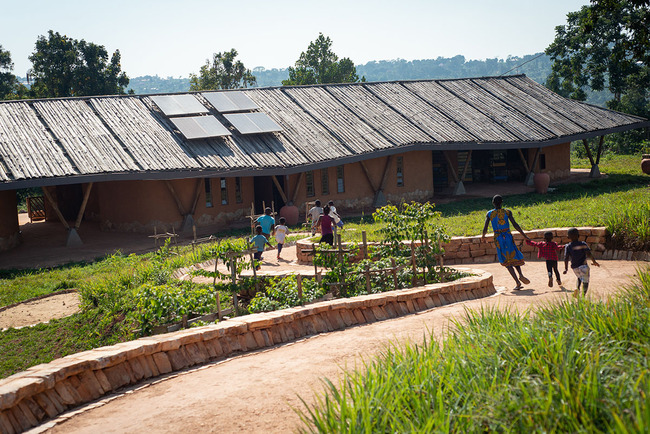 Localworks built junior school with organically shaped classrooms made of earthbags in Uganda