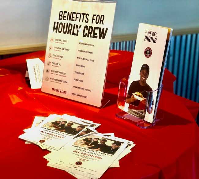 Chipotle Mexican Grill is raising wages to an average of $15 an hour by June and offering cash referrals to employees as the chain seeks 20,000 workers