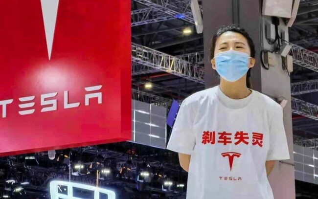 Tesla Slides on Shanghai Expansion Halt Report: Musk Polls On Dogecoin