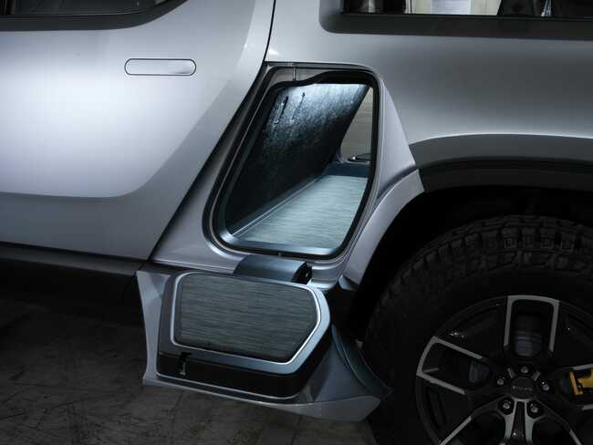 Rivian's R1T pickup has an air compressor, a built-in cooler under the bed, and a tailgate you can control through an app