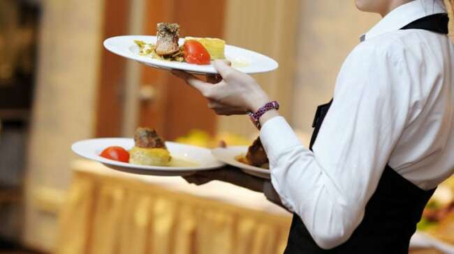 Compass Group's underlying operating profit slides 65% in H1