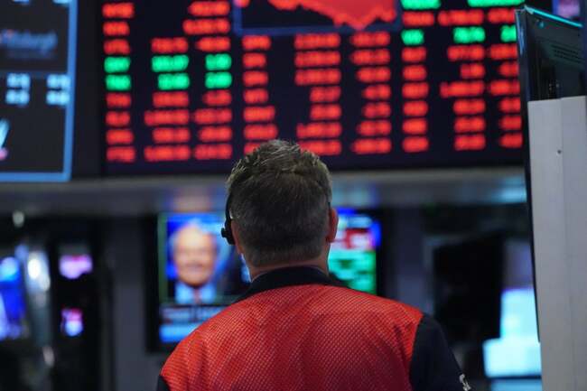 FTSE 100 closes above 7,000, but US stocks tumble amid inflation data