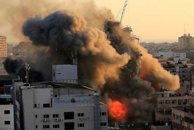 Israel is preparing a possible invasion of Gaza, moving ground troops as the death toll from rockets and air strikes hits 90