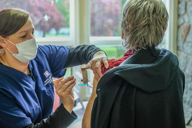 Vaccinated people can ditch masks and social distancing in most places, CDC says