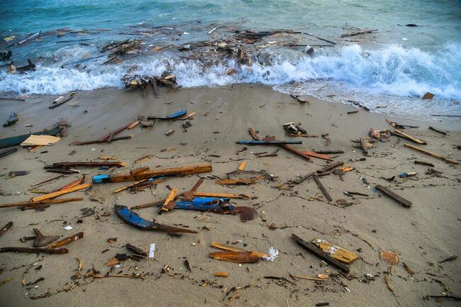 Migrant boat breaks up off Italian coast, killing nearly 60