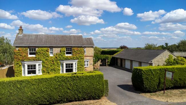 Family home in Warboys with triple garage and countryside views