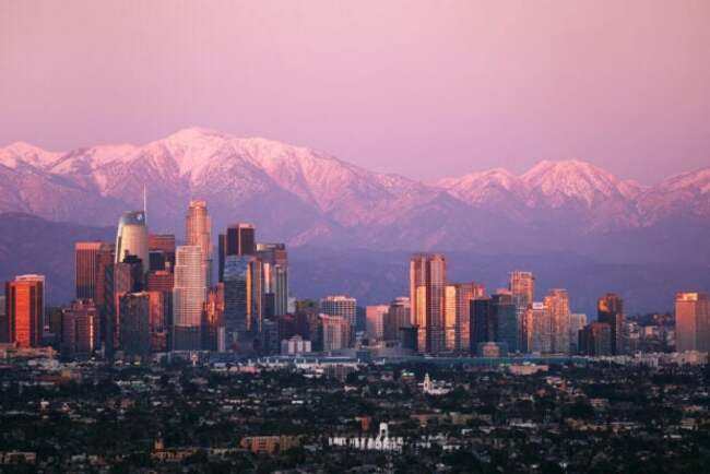 Three Los Angeles police officers shot, suspect barricaded–report