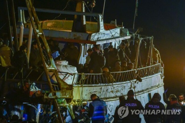 CORRECTION Migration Italy