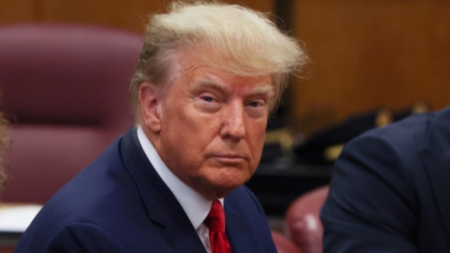 Trump charged with 34 counts of falsifying business records, pleads not guilty