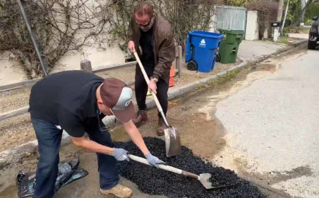 Fed up with local LA pothole Arnold Schwarzenegger fills it in himself