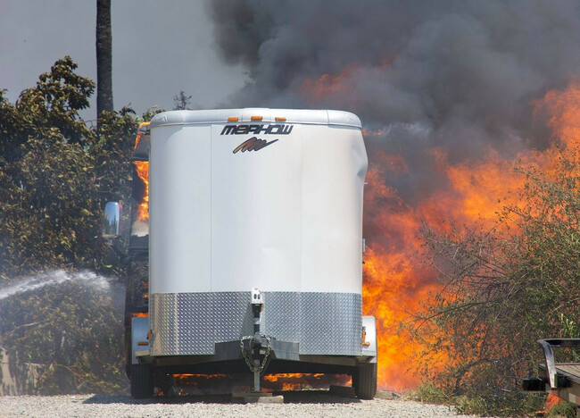 Flames burn trees, vehicles on ranch in Riverside