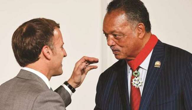 Macron decorates rights activist Jesse Jackson