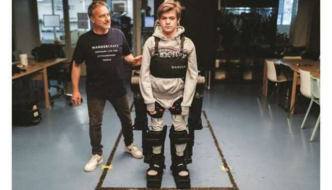 Dad builds exoskeleton to help wheelchair-bound son walk