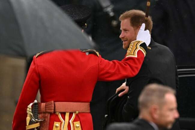 Smiling Prince Harry arrives at Westminster Abbey