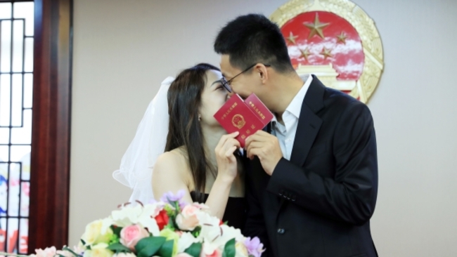 Couples rush to tie knot on 'I love you' day