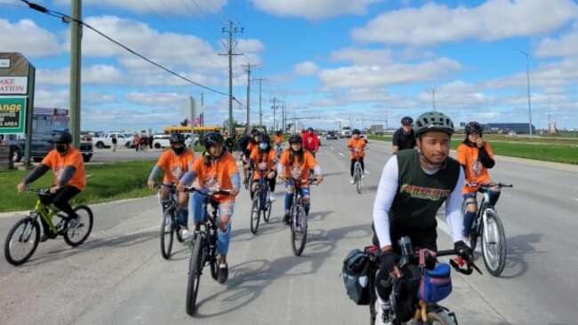 Members of First Nation experiencing suicide crisis welcome youth cycling across Canada