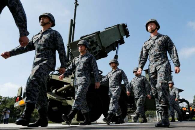 Japan puts missile defenses on alert as North Korea warns of satellite launch
