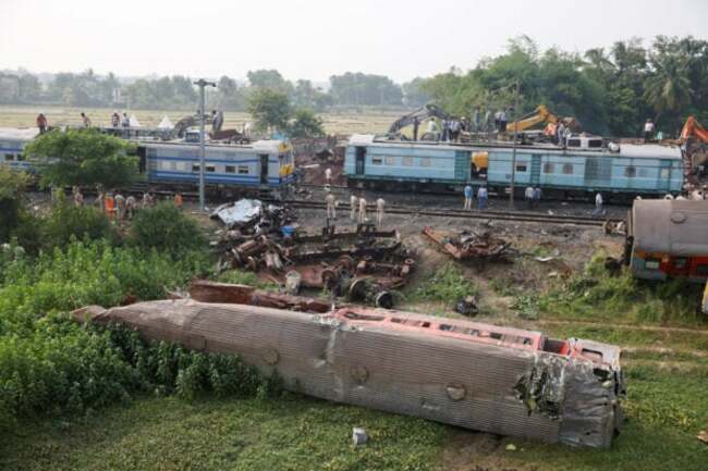 Families, rescuers search for victims of India's worst train crash in decades