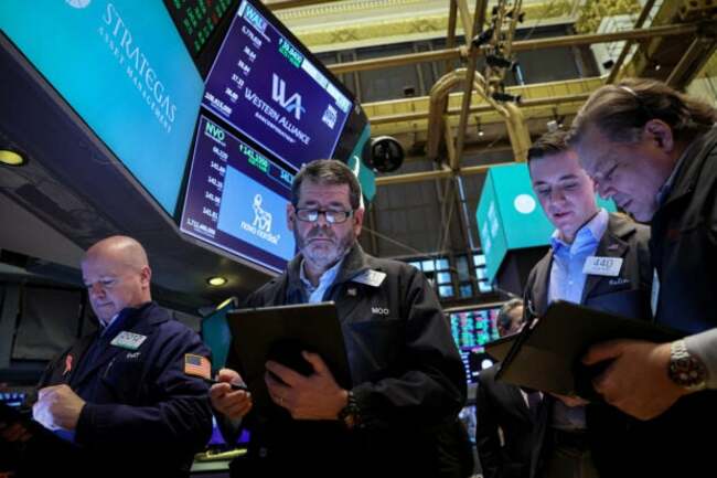 Wall Street ends up amid record low volatility ahead of eventful week