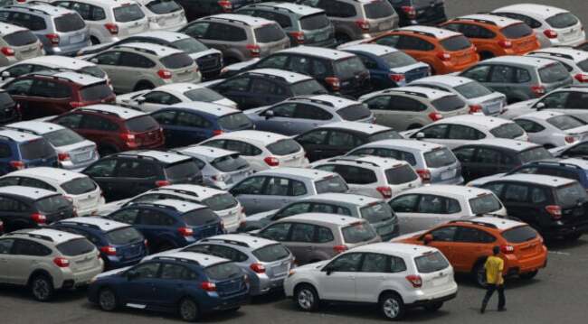 Japan exports grow unexpectedly on solid car sales, global demand still uneven