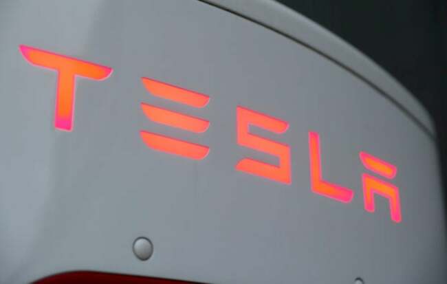 Tesla shares near $300 on spike in deliveries, deal with major automakers