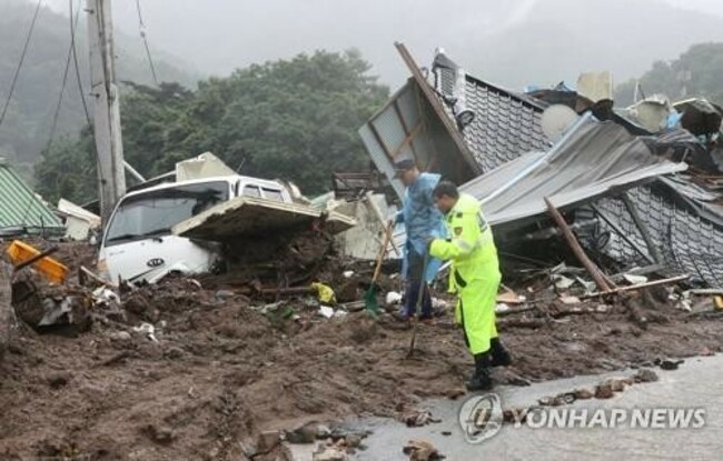 Torrential rains leave at least 32 dead, more than 10 missing