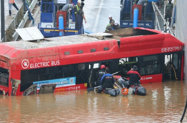 Coworkers say don't blame the bus driver killed in flood