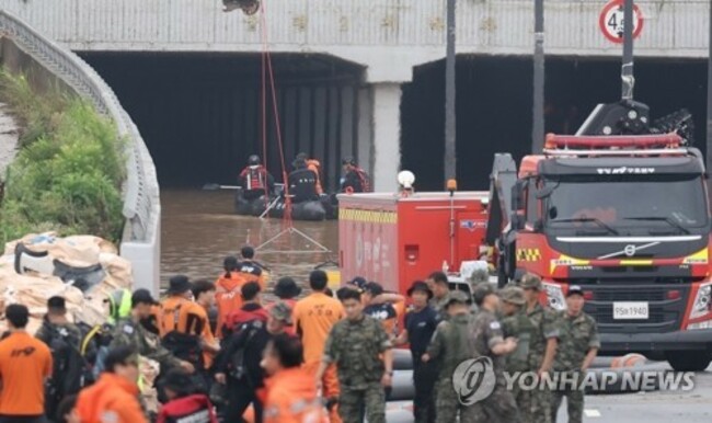(2nd LD) 49 dead or missing in downpours after 4 more bodies recovered from underground road