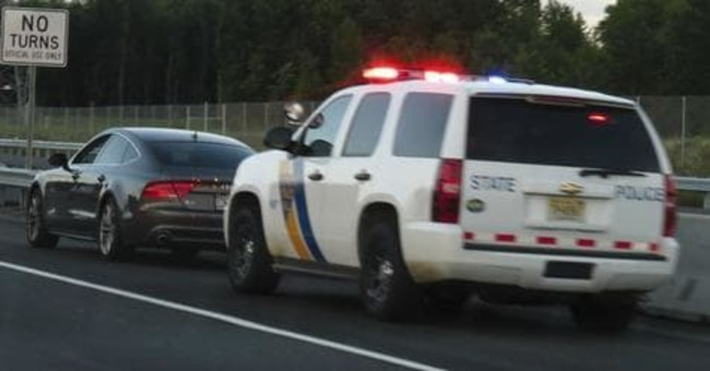 Police Officer Takes Forever To Exit His Patrol Car, Couple Quickly Realize Why
