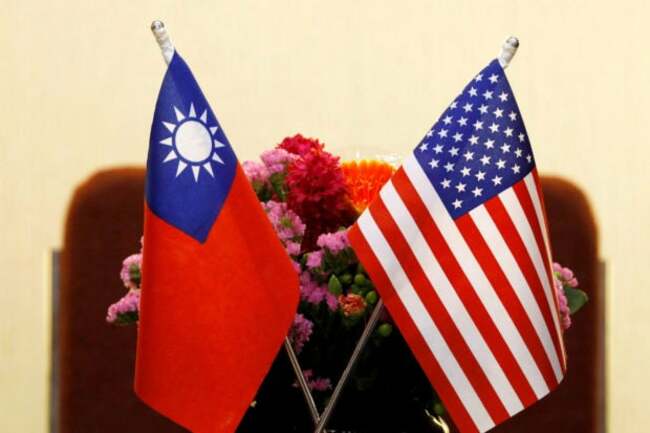 Biden signs law implementing first part of US trade pact with Taiwan