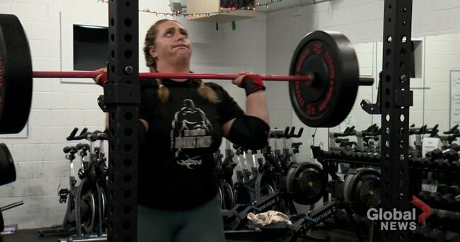 Local strongwoman Jackie Osczevski lifting bars, cars and community