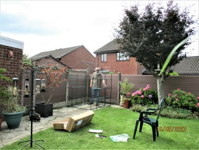 Paul building our garden green house