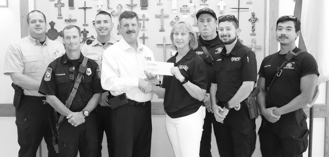 Church dinner funds checks for worthy agencies