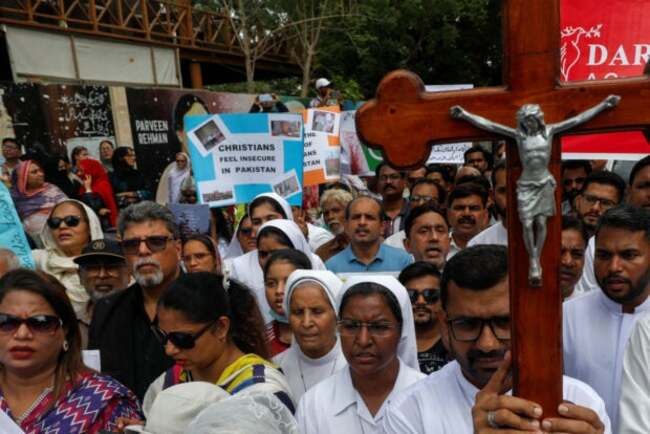 Pakistani Christians hold Sunday services at churches burnt by mob