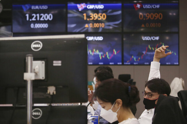 World shares mixed as economic data cloud outlook