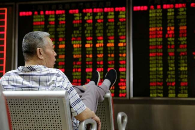 China halves stock trade tax to boost market