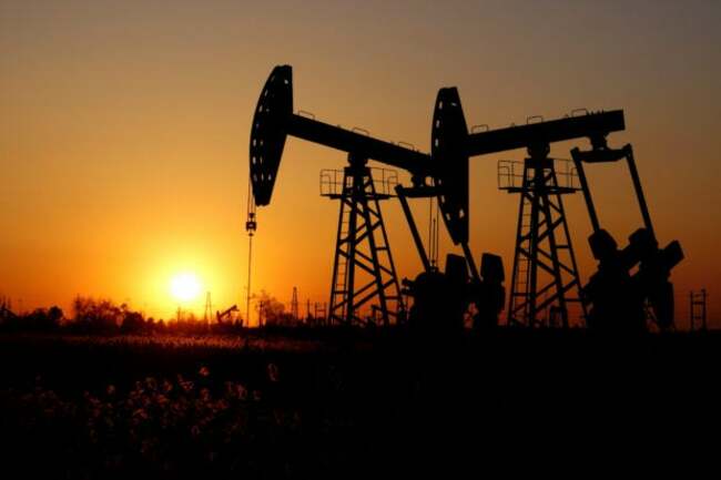 Oil prices settle at 10-month high as Saudi, Russia extend supply cuts