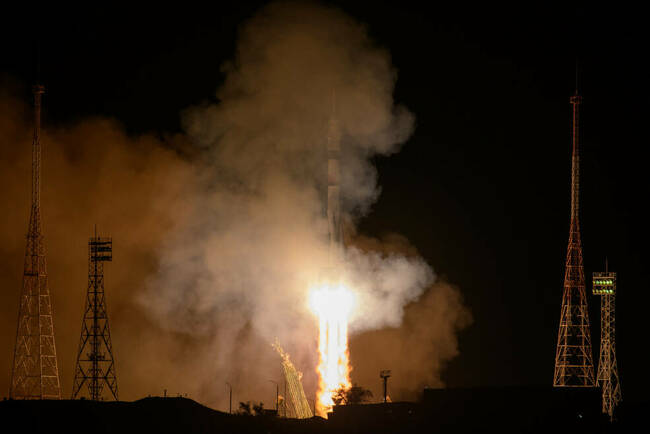 NASA Astronaut, Team Touch Down at Space Station for Expedition