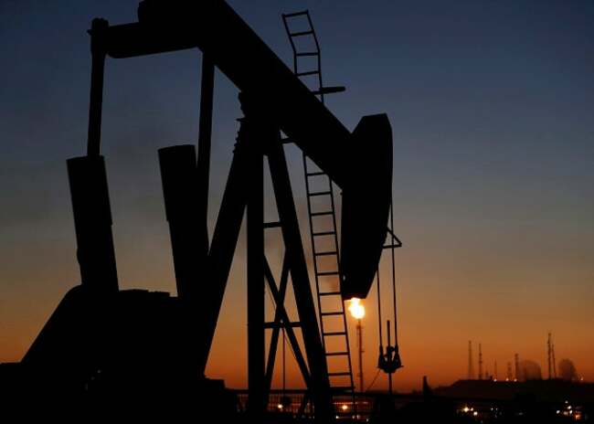 Oil prices settle nearly flat as Russia eases fuel export ban