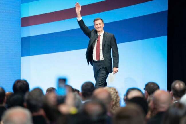 Britain's Treasury chief raises minimum wage, rules out tax cuts