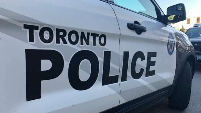 Woman found dead in middle of the road in west Toronto