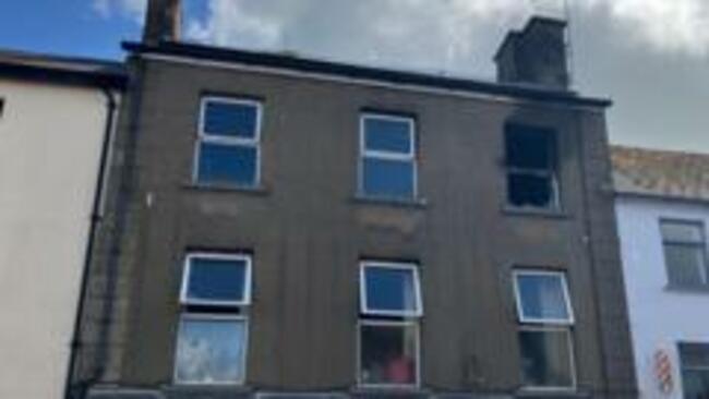 Murder arrest after businessman dies in house fire