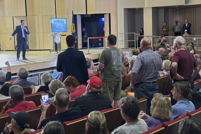Nebraska Republican is shouted down by a hostile crowd at a town hall on Trump’s tax cuts