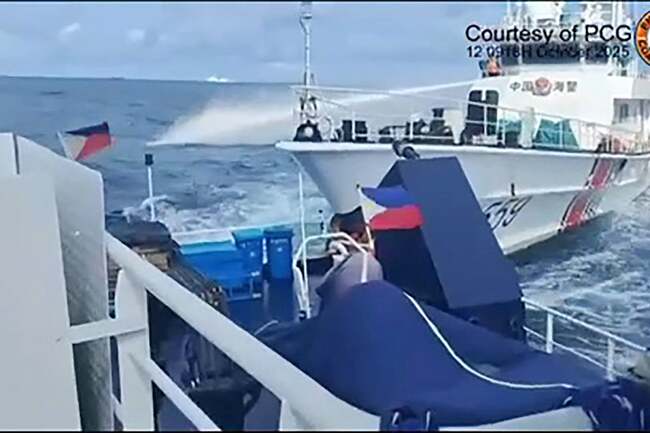 Chinese coast guard fires water cannon and rams Philippine vessel in disputed South China Sea