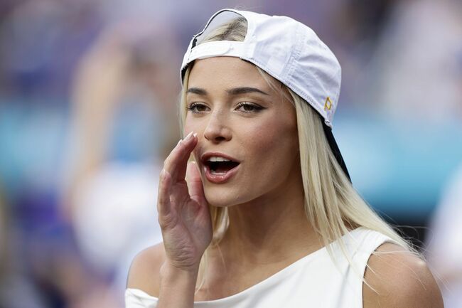 Olivia Dunne poses in leopard print outfit while cheering for LSU in match against South Caroline