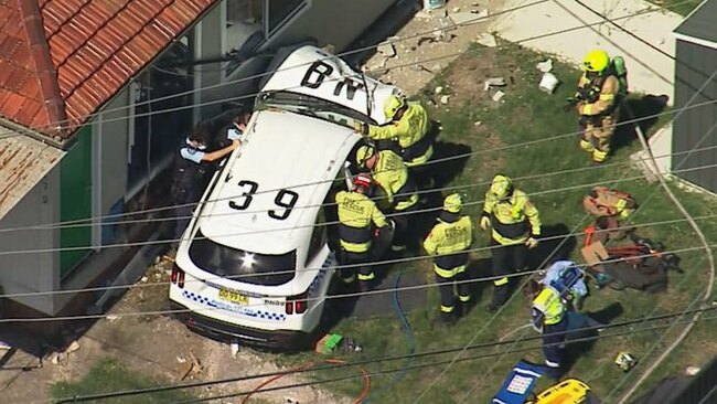Officer trapped in cop car that crashed into western Sydney home