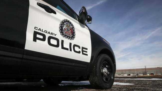 Man in custody after Calgary firefighter dragged by stolen car: police