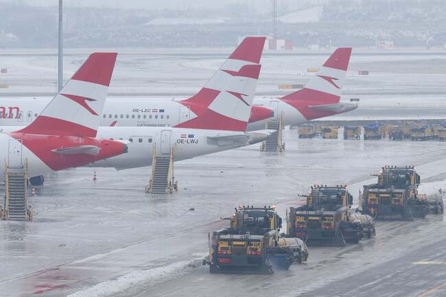 Travellers stranded as icy conditions close airports across central Europe